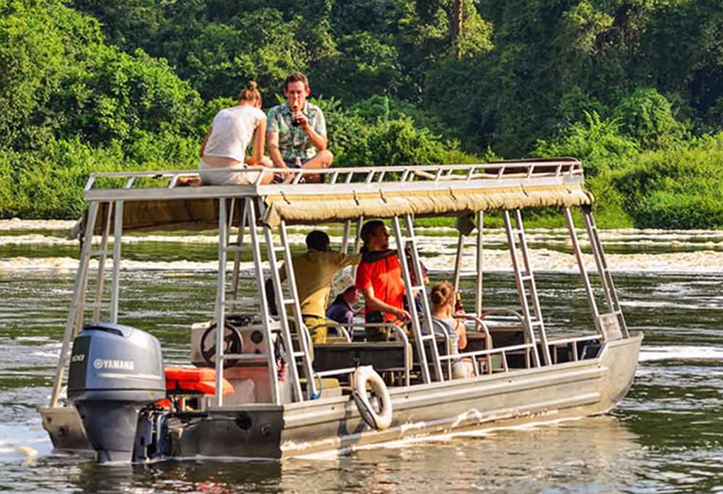 Adventurer white-water rafting on the Nile River in Uganda, surrounded by lush green landscapes and dramatic rapids.