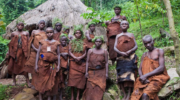 A Batwa elder teaching traditional hunting skills in Uganda’s rainforest